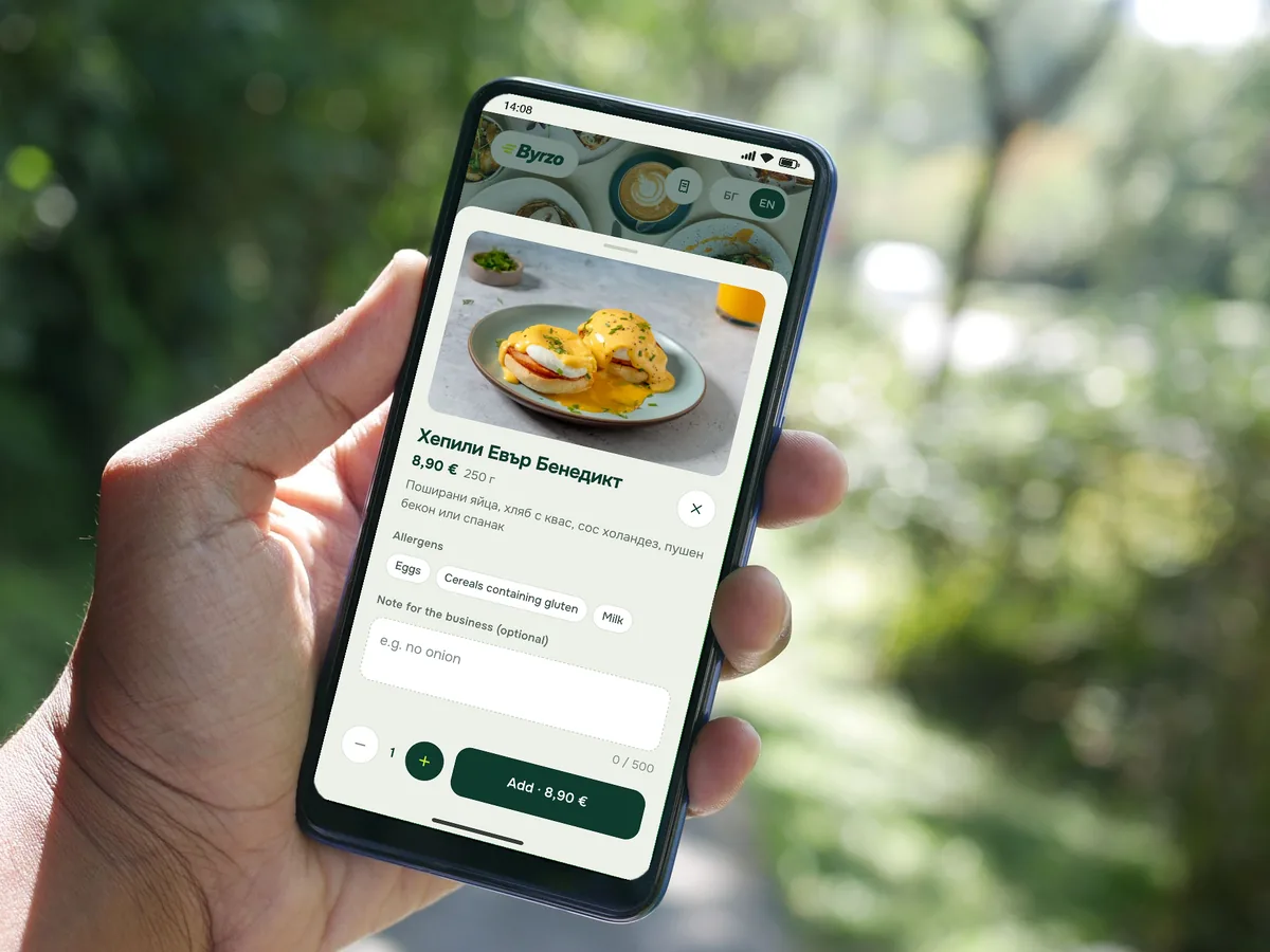 A hand holding a phone with a dish from a demo restaurant’s menu: photo, portion size and price